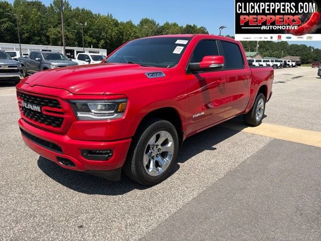 2022 RAM 1500 Big Horn in Red — front three-quarter view