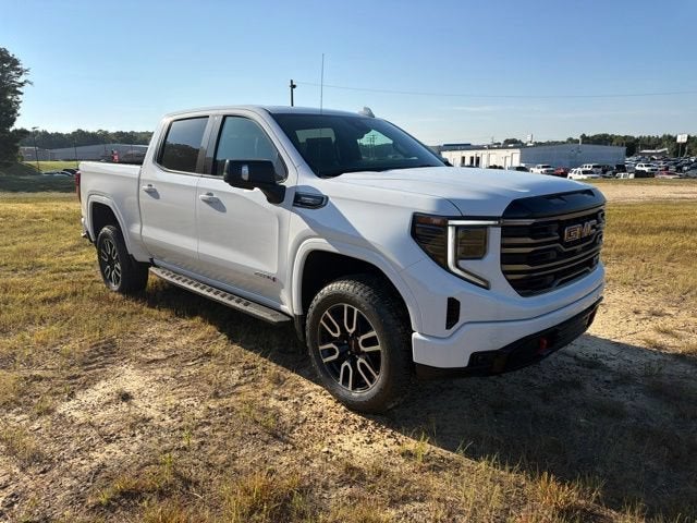2026 GMC Sierra 1500 AT4 in Summit White — front three-quarter view