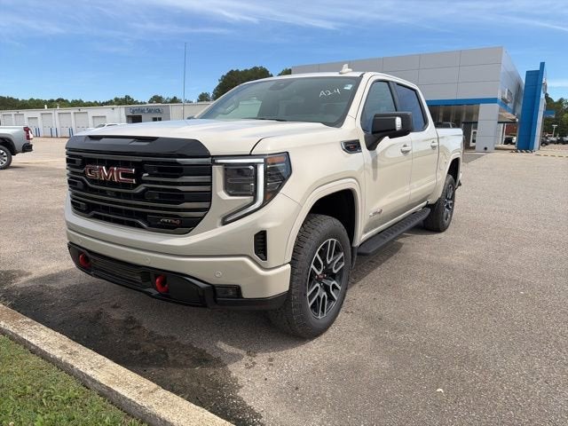 2026 GMC Sierra 1500 AT4 in Coastal Dune — front three-quarter view