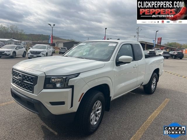 2024 Nissan Frontier SV in White — front three-quarter view
