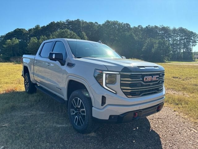 2026 GMC Sierra 1500 AT4 in Coastal Dune — front three-quarter view
