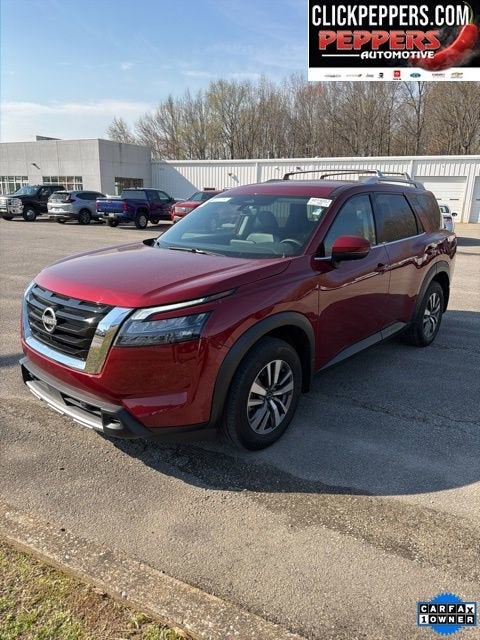 2025 Nissan Pathfinder SL in Red — front three-quarter view