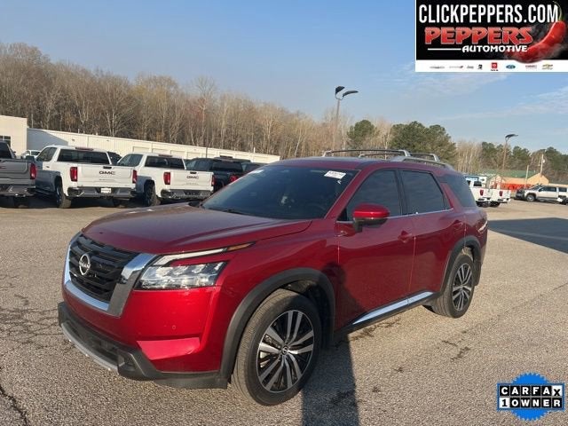 2024 Nissan Pathfinder Platinum in Red — front three-quarter view