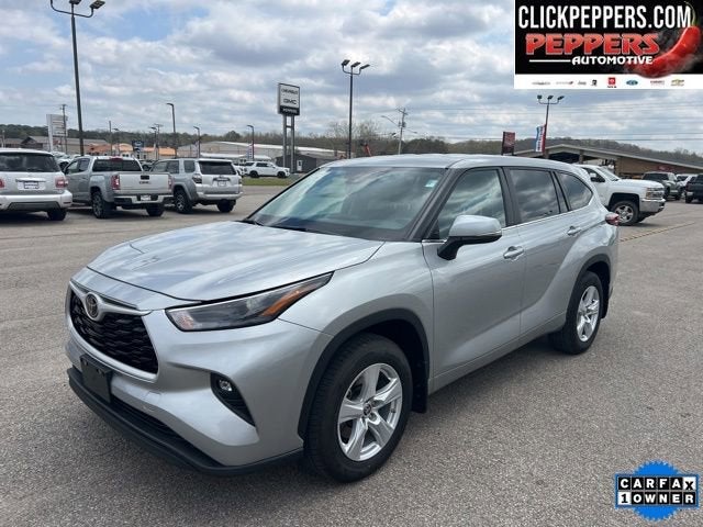 2024 Toyota Highlander LE in Silver — front three-quarter view